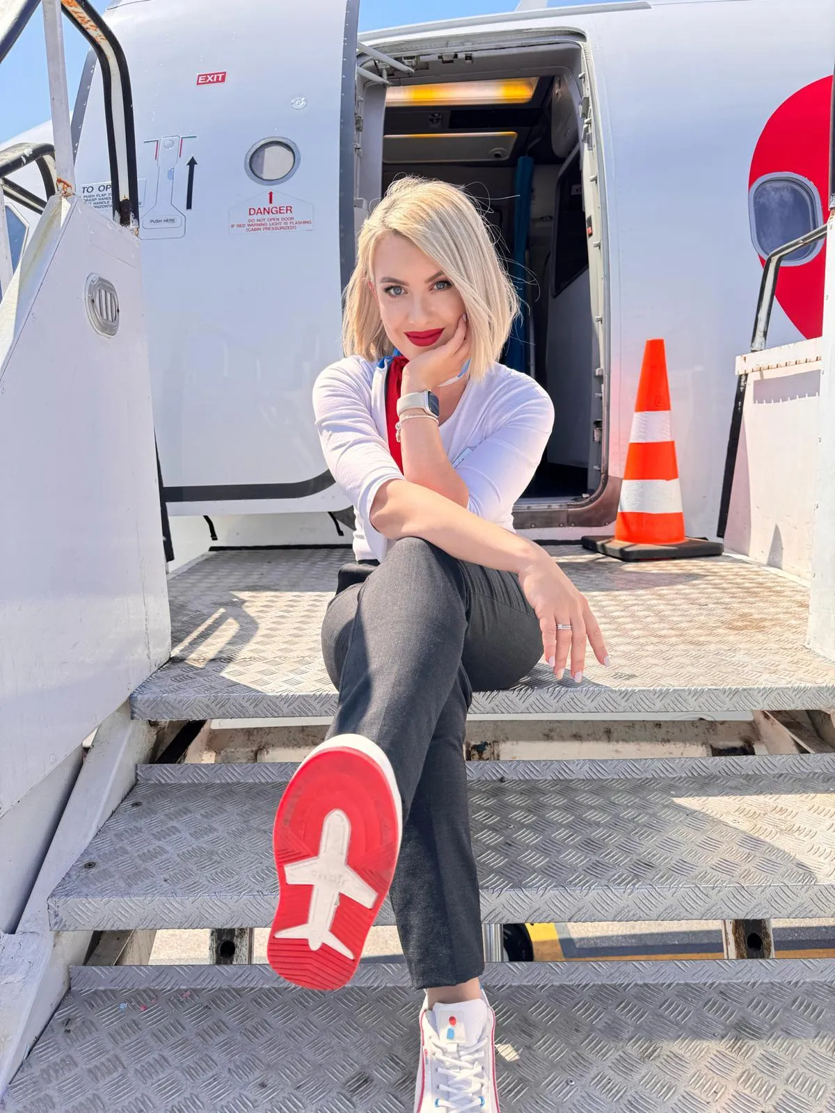 Chair Airlines cabin crew member wearing the custom sneaker